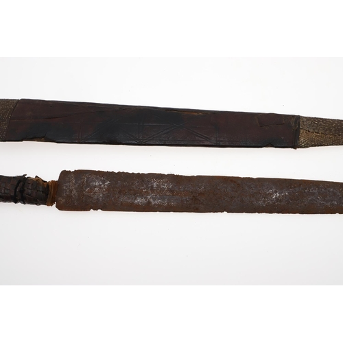 128 - AN AFRICAN LONG-BLADED KNIFE AND LEATHER COVERED SCABBARD. With a 41cm pointed tapering blade with a... 