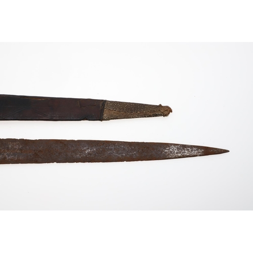 128 - AN AFRICAN LONG-BLADED KNIFE AND LEATHER COVERED SCABBARD. With a 41cm pointed tapering blade with a... 