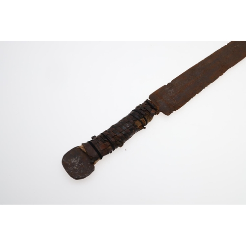 128 - AN AFRICAN LONG-BLADED KNIFE AND LEATHER COVERED SCABBARD. With a 41cm pointed tapering blade with a... 