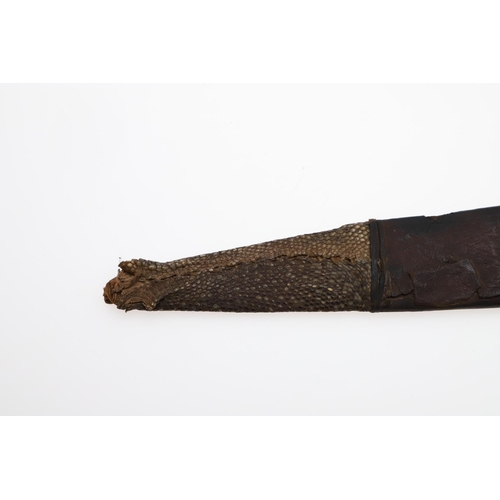 128 - AN AFRICAN LONG-BLADED KNIFE AND LEATHER COVERED SCABBARD. With a 41cm pointed tapering blade with a... 