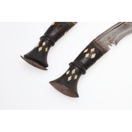 130 - TWO LATE 19TH OR EARLY 20TH CENTURY KUKRI, ONE WITH SCABBARD. A Kukri with traditional 35cm shaped b... 