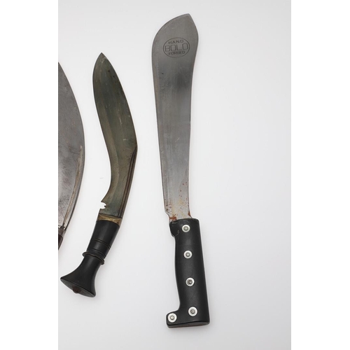 132 - A COLLECTION OF KUKRI KNIVES. A Military issue Kukri knife with traditionally shaped 34cm blade with... 