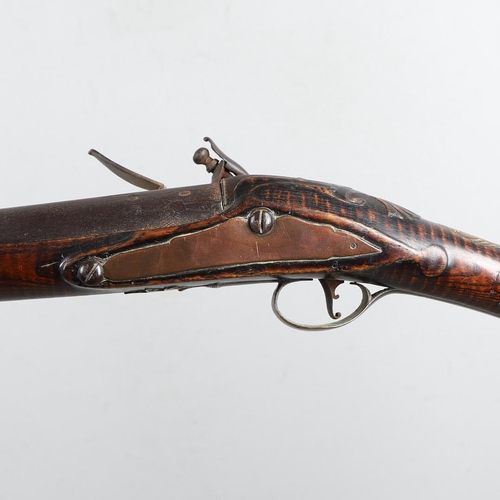 14 - A MID 18TH CENTURY FLINTLOCK GUN BY JOHNSON. With a 96.5cm tapering circular barrel with stamped pro... 