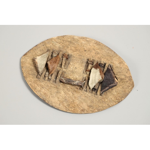 152 - TWO ZULU TYPE COWHIDE SHIELDS AND SIMILAR SPEARS. A Zulu black and whit cowhide shield 66 x 43cm wit... 