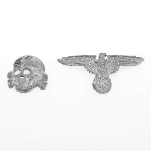 165 - A SET OF SECOND WORLD WAR GERMAN SS CAP INSIGNIA. A cap insignia set comprising zinc eagle and secon... 