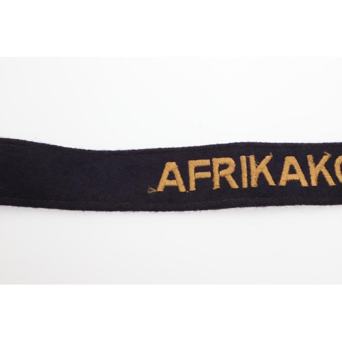 173 - A SECOND WORLD WAR GERMAN LUFTWAFFE 'AFRIKAKORPS' CUFFBAND. An early pre-regulation type with machin... 