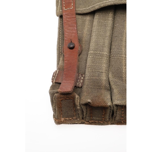 176 - A SECOND WORLD WAR GERMAN AMMUNITION POUCH. A German ammunition pouch for six sub-machine gun magazi... 