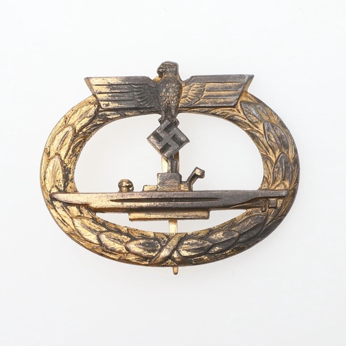 194 - A GERMAN KRIEGSMARINE U-BOAT BADGE. An unmarked u-Boat badge with U-Boat beneath an eagle, within a ... 