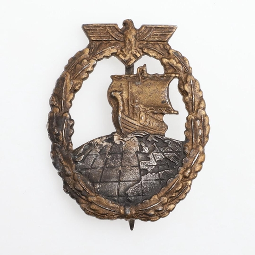 195 - A GERMAN KRIEGSMARINE AUXILIARY CRUISER BADGE. An Auxiliary Cruiser badge marked to the reverse for ... 