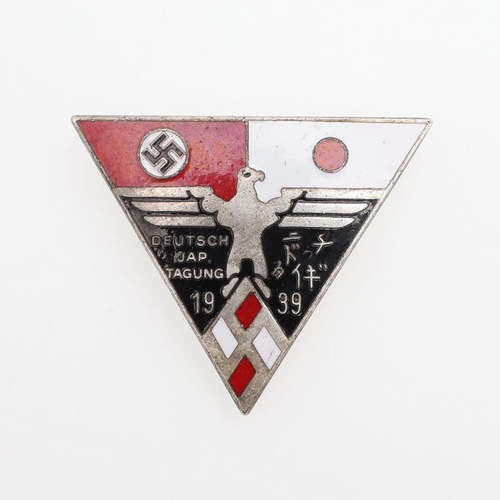 197 - A GERMAN - JAPANESE STUDENT FRIENDSHIP LEAGUE BADGE. A triangular badge in white red and black ename... 