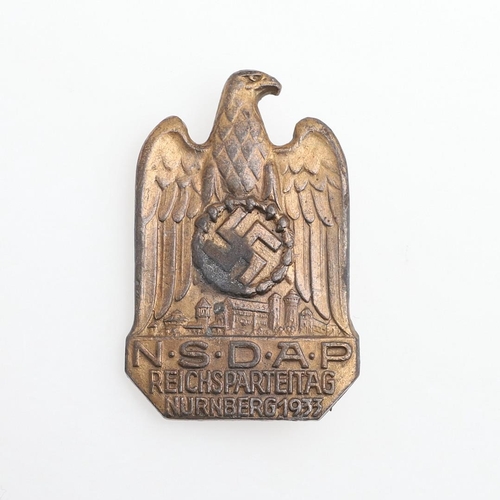 204 - A GERMAN NSDAP RALLY BADGE,1933. A German inter-war party rally badge with a large eagle with swasti... 