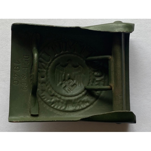 209 - A SECOND WORLD WAR GERMAN WARTIME BELT BUCKLE. A Second World War German Army Belt buckle, a wartime... 