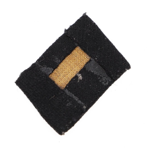 215 - A WAFFEN SS MAN'S RUNES COLLAR PATCH. A collar patch with twin runes in pale grey cotton on a black ... 