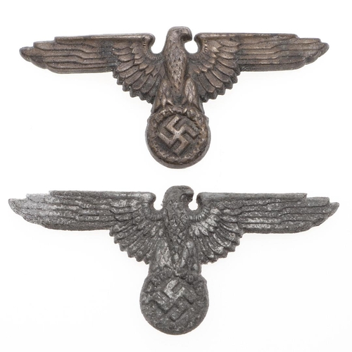 218 - TWO WAFFEN SS PEAKED CAP EAGLES. Two late war type peaked cap eagles in zinc with brass pins, hollow... 