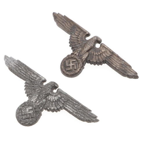 218 - TWO WAFFEN SS PEAKED CAP EAGLES. Two late war type peaked cap eagles in zinc with brass pins, hollow... 