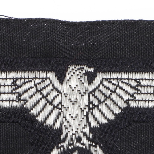 224 - A WAFFEN-SS OFFICERS BEVO TYPE CAP EAGLE. A Bevo type cap eagle, for a Waffen-SS Officer, machine wo... 