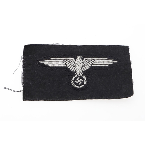 224 - A WAFFEN-SS OFFICERS BEVO TYPE CAP EAGLE. A Bevo type cap eagle, for a Waffen-SS Officer, machine wo... 