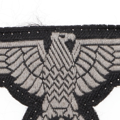 225 - A WAFFEN-SS MAN'S BEVO TYPE ARM-EAGLE. A Man's Bevo type arm-eagle machine woven in grey silk type t... 