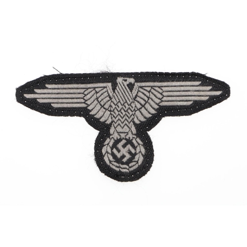 225 - A WAFFEN-SS MAN'S BEVO TYPE ARM-EAGLE. A Man's Bevo type arm-eagle machine woven in grey silk type t... 