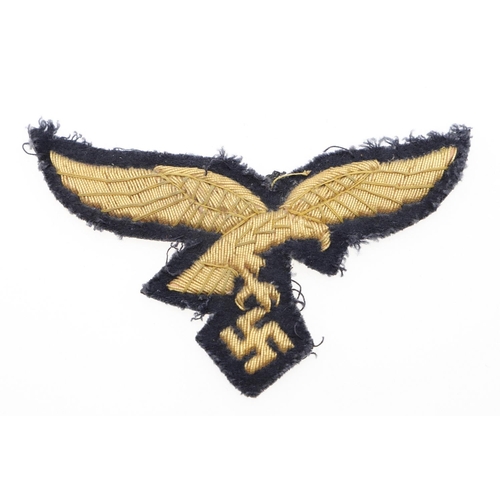 227 - A LUFTWAFFE GENERAL'S BREAST EAGLE. A gold bullion type breast eagle with a flying eagle with swasti... 