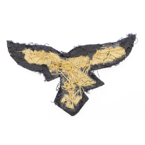 227 - A LUFTWAFFE GENERAL'S BREAST EAGLE. A gold bullion type breast eagle with a flying eagle with swasti... 