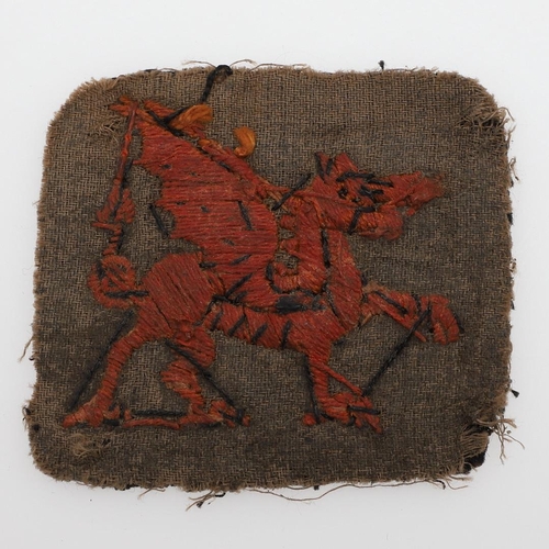 228 - A FIRST WORLD WAR 38TH WELSH DIVISION ARM PATCH. A 38th Division (Welsh) Arm Patch with a red dragon... 