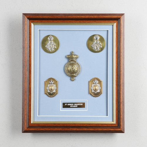 229 - A COLLECTION OF 1ST KING'S DRAGOON GUARDS HORSE HARNESS FURNITURE. A well presented framed collectio... 