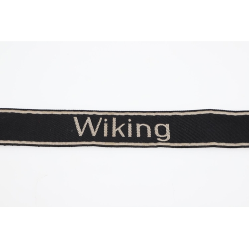 237 - A SECOND WORLD WAR GERMAN 'WIKING' CUFF TITLE. A machine embroidered cuff title 'Wiking' in white ag... 