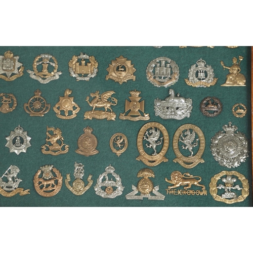 239 - AN EXTENSIVE COLLECTION OF MILITARY CAP BADGES AND OTHERS. An extensive collection of military badge... 
