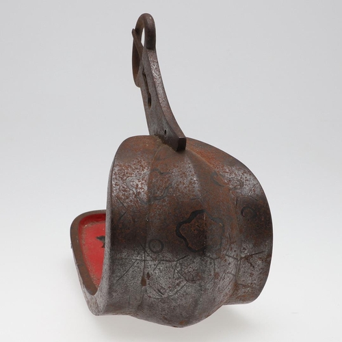 254 - AN IDO PERIOD JAPANESE INLAID IRON PARADE STIRRUP. A samurai iron parade stirrup with red interior, ... 