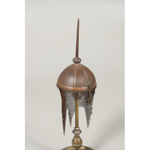 256 - A 19TH CENTURY INDO-PERSIAN KULAH KHUD HELMET. With an iron domed bowl with a 22cm spike to the top,... 