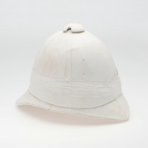 260 - A WOLSELEY PATTERN TROPICAL HELMET. A Wolseley pattern tropical helmet with white finish, pointed pe... 