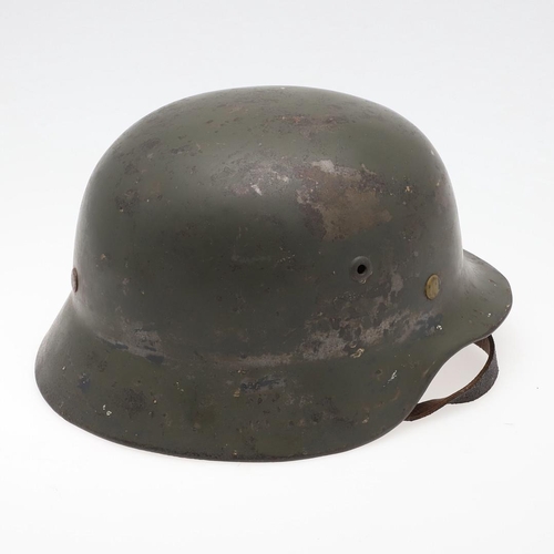 271 - A BLACK M40 TYPE HELMET AND LINER. A Second World War or later finished M40 type steel helmet shell,... 