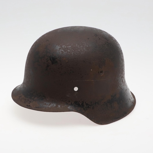 273 - A BLACK WAFFEN SS SINGLE DECAL M42 HELMET. A Second World War or later M42 type helmet shell, with w... 