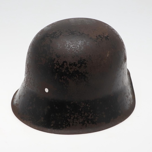 273 - A BLACK WAFFEN SS SINGLE DECAL M42 HELMET. A Second World War or later M42 type helmet shell, with w... 