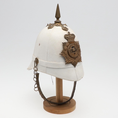 274 - A WHITE FOREIGN SERVICE HELMET WITH SOUTH WALES BORDERERS HELMET PLATE. With a brass hexagonal spike... 