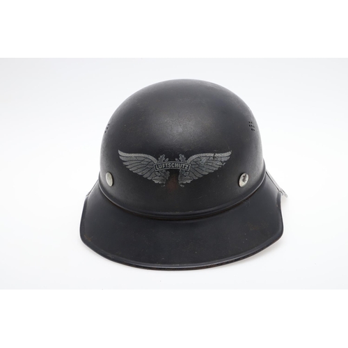 276 - A GERMAN LUFTSCHUTZ GLADIATOR PATTERN HOME DEFENCE HELMET. A Steel helmet with four seven hole air v... 