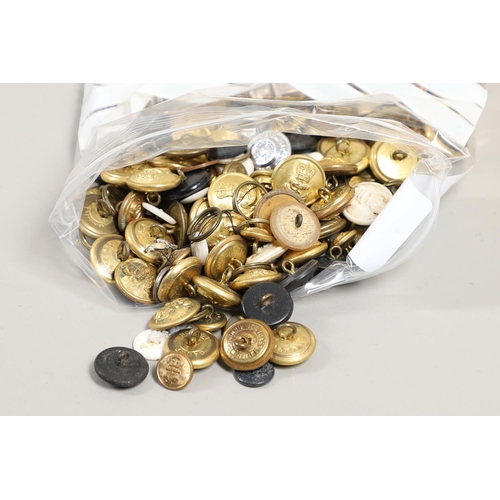 299 - A COLLECTION OF ROYAL NAVY BUTTONS AND INSIGNIA AND A LARGE SHELL CASING. A large polished brass she... 