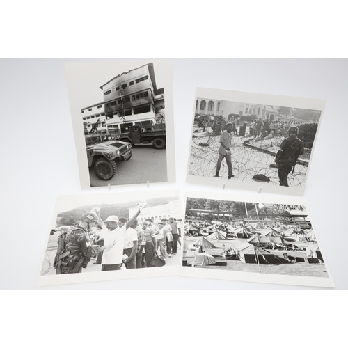 312 - A COLLECTION OF TWENTY FOUR PHOTOGRAPHS OF 'OPERATION JUST CAUSE', PANAMA 1989/1990.  A collection o... 