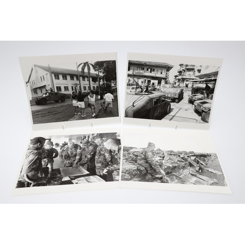 312 - A COLLECTION OF TWENTY FOUR PHOTOGRAPHS OF 'OPERATION JUST CAUSE', PANAMA 1989/1990.  A collection o... 