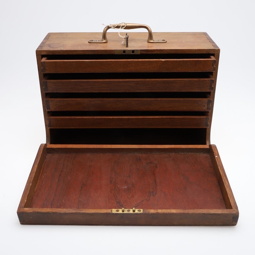 316 - A PORTABLE COLLECTORS CABINET. A wooden collectors cabinet with a brass carrying handle, the fall-fr... 