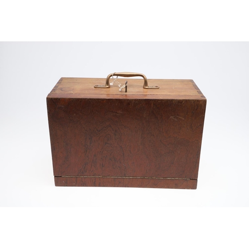 316 - A PORTABLE COLLECTORS CABINET. A wooden collectors cabinet with a brass carrying handle, the fall-fr... 