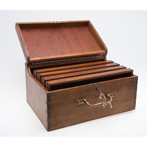 316 - A PORTABLE COLLECTORS CABINET. A wooden collectors cabinet with a brass carrying handle, the fall-fr... 