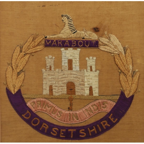 318 - A NEEDLEWORK DORSETSHIRE REGIMENTAL BADGE. A Dorsetshire Regimental needlework, finely sewn with the... 