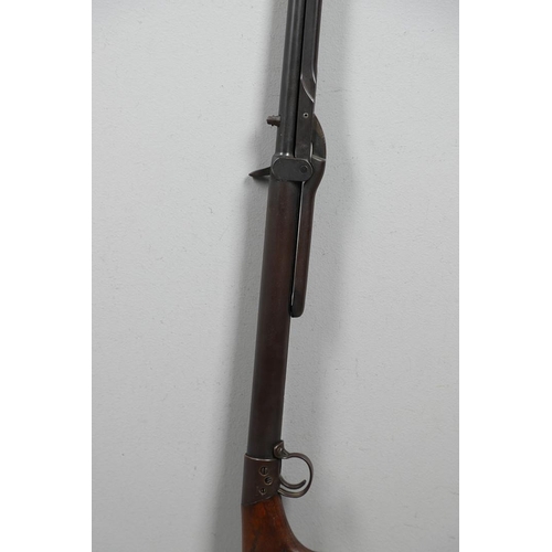 46 - A BSA .22 'T' MODEL AIR RIFLE. With a 49cm barrel and rotating loading point, numbered T1161 above t... 