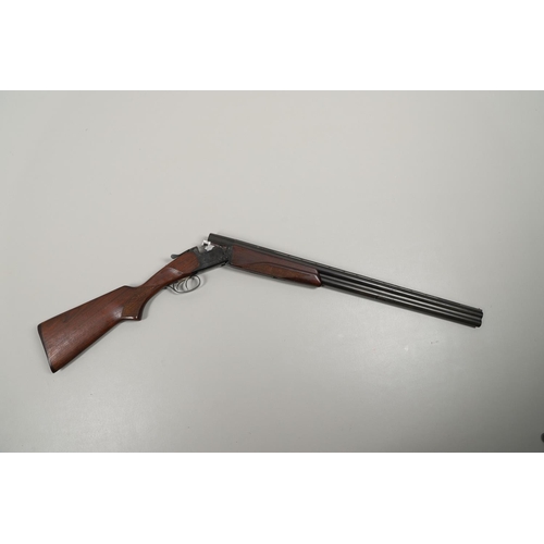 56 - A RUSSIAN MADE 12 BORE DOUBLE BARREL SHOTGUN. With 86cm over and under ejector barrels, the parts nu... 
