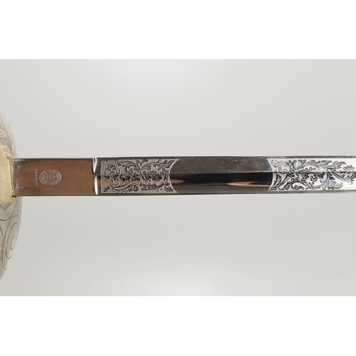 88 - AN ELIZABETH II 1912 PATTERN PRESENTATION SWORD AND SCABBARD. With an 86cm single edged pointed and ... 