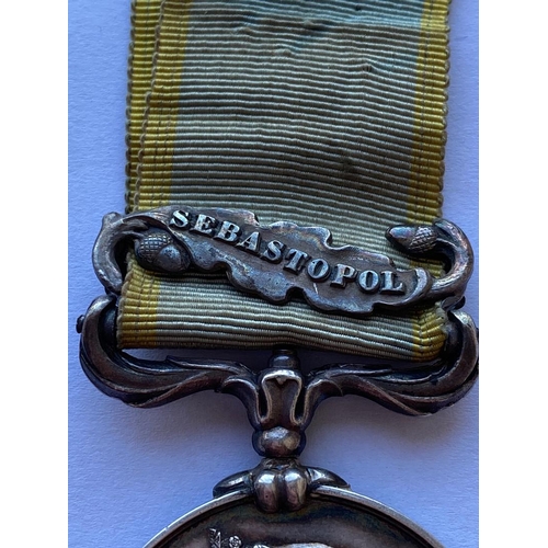 456 - A CRIMEA MEDAL WITH SEBASTOPOL CLASP TO THE EARL OF ULSTER'S REGIMENT OF FOOT. Named to 1054 Pte P. ... 