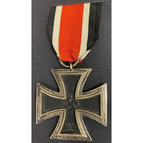 510 - A SECOND WORLD WAR GERMAN IRON CROSS 2ND CLASS. A German Iron Cross dated 1939, on a short length of... 