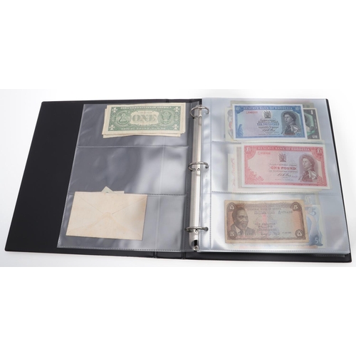 559 - TWO ALBUMS OF WORLD BANKNOTES. Approximately 132 World Banknotes to include notes from America, Keny... 